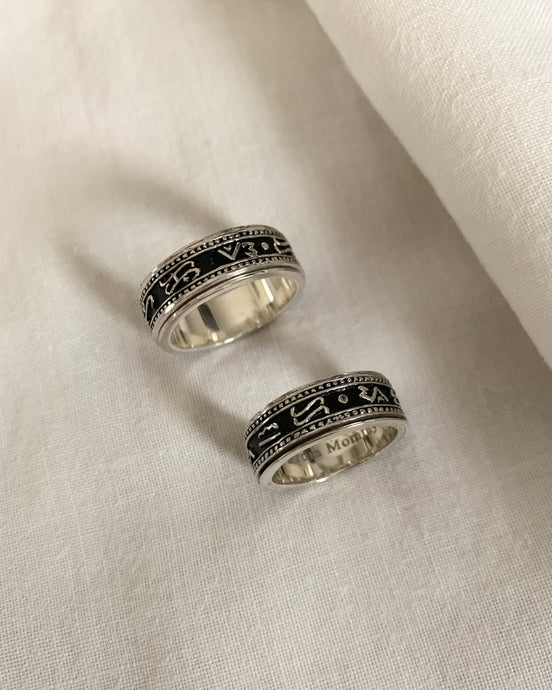 A Silver Ring engraved with Baybayin characters with a black background. Also server as an anti-anxiety spinner ring.
