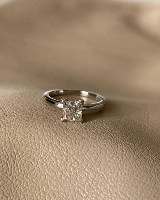 One carat princess cut diamond ring set in white gold.