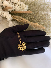 Load image into Gallery viewer, Heart-shaped monogram with three names. Set in 18K yellow gold.
