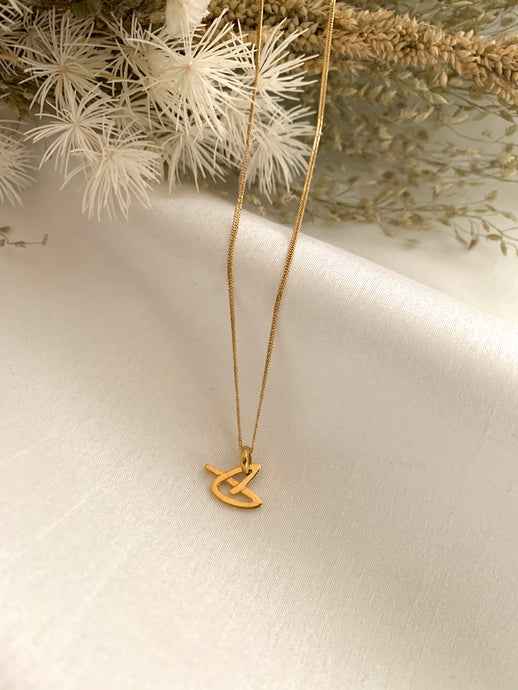 A P shaped in a heart design pendant. Pendant and necklace both set in 18K yellow gold. Chain in 18