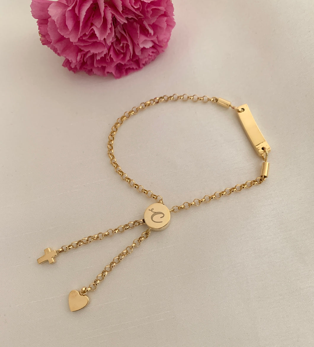 Yellow gold engravable pull-tie bracelet. With a 
