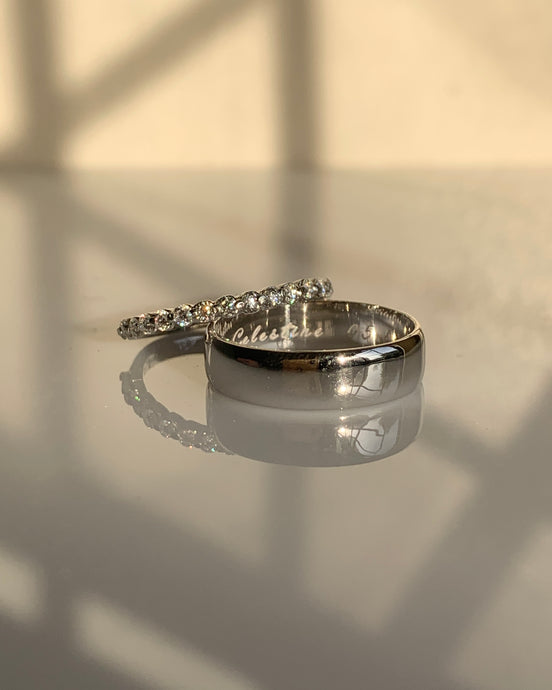 For the bride-moissanites half eternity ring set in white gold. For the groom-a simple classic white gold wedding band.