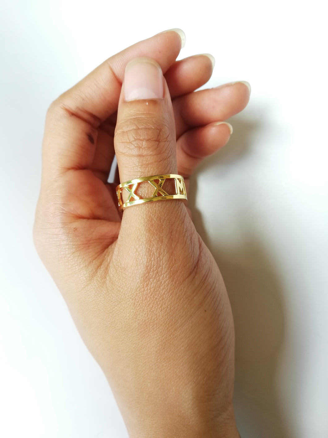 A yellow gold band ring. With roman numerals of your choice. 