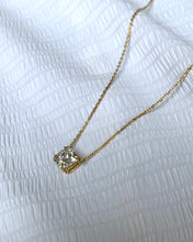 Load image into Gallery viewer, A beautifully set cushion-cut signity on a double prong open basket. Seems floating on an 18k gold classic chain.
