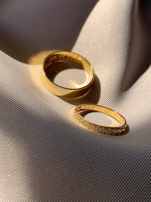 Yellow gold wedding bands. For her, it is a full eternity ring with bright diamonds.