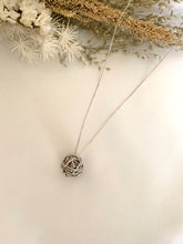 Load image into Gallery viewer, Pendant is a white gold ball of yarn in a white gold chain necklace.
